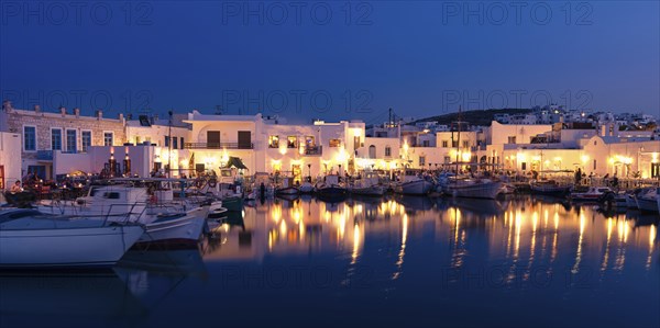 Traditional Greek fishing village and harbour after sunset