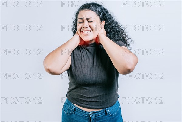 Girl with neck pain isolated. Young woman suffering with neck pain. Neck pain and stress concept. People with neck tension