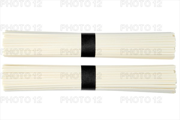 Uncooked bunch of Udon noodle isolated on white background