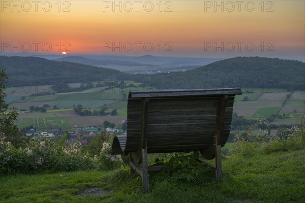 Wooden lounger in the sunset