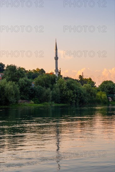 View of Kisha Katolike Eternit Capucin from a boat on a sightseeing excursion on Lake Shkoder in Shiroka. Albania