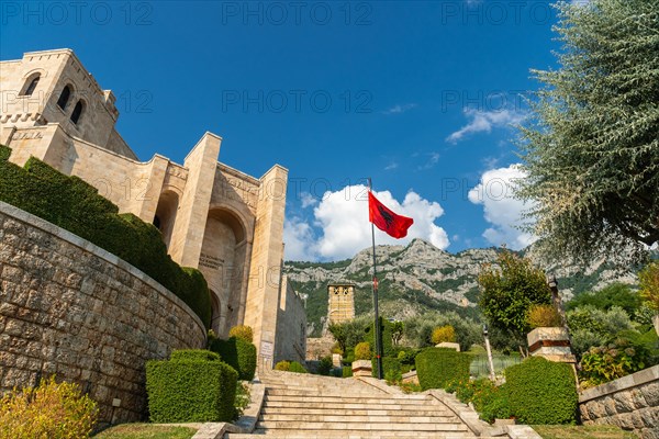 Stairs inside Kruje Castle and its fortress with the walls and mountains in the background. Albania