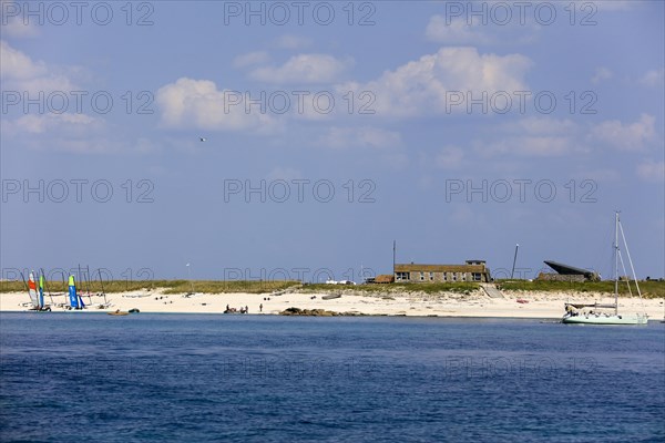 Sandy beach beach of the island Ile de Penfret with sailing school Les Glenans