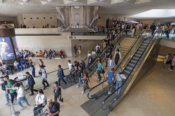 Visitors in the basement of the Louvre pyramid