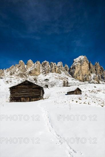 Snow-covered mountains and alpine hut