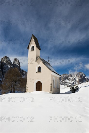 Snow-covered mountains and chapel