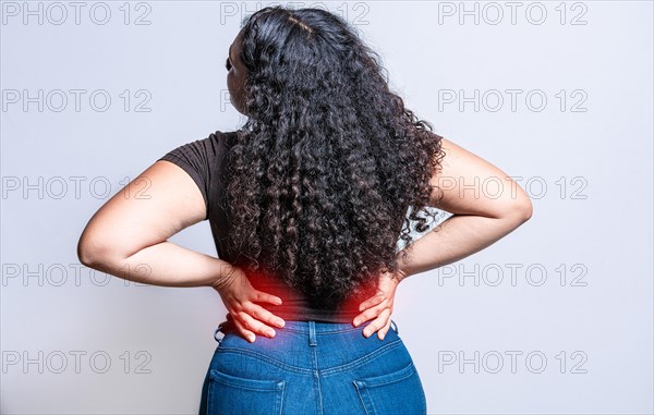 People with spine problems. Woman with back pain on isolated background. lumbar problems concept. A sore girl with back pain