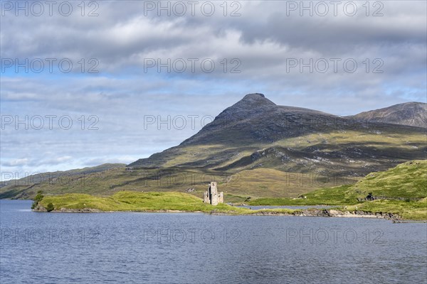 The ruins of Ardvreck Castle on a peninsula by the loch of Loch Assynt