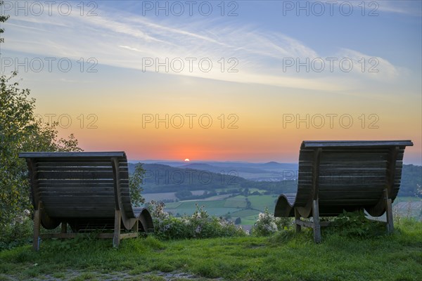 Wooden loungers in the sunset