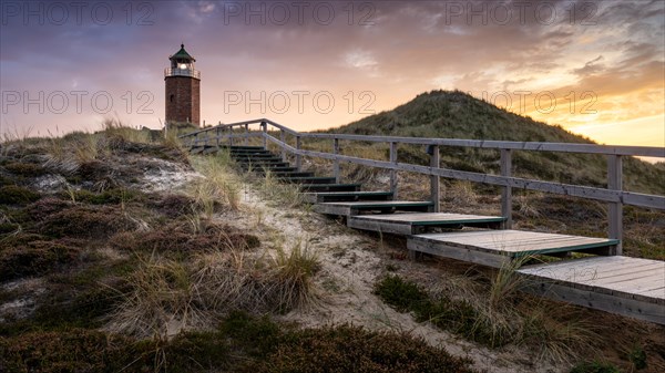 Colourful sunset behind the smallest lighthouse