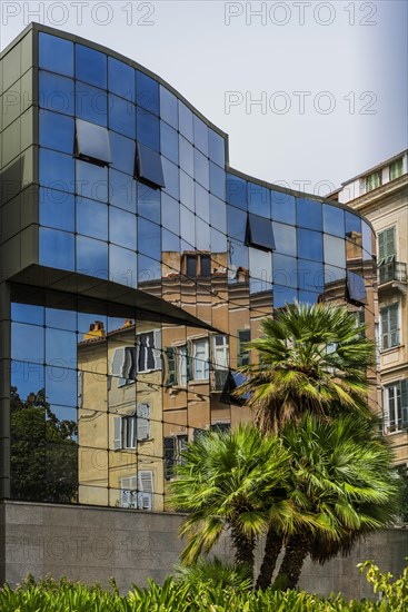 Reflection of the old town of Ajaccio in a modern house facade