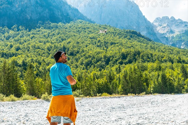 Drone pilot man taking off the drone on the mountain in Valbona natural park on vacation. Albania