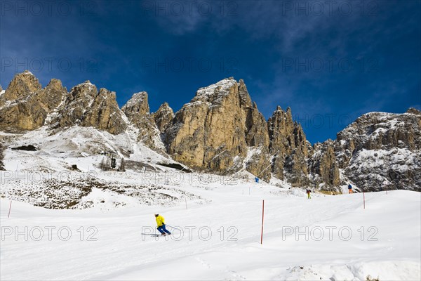 Snow-covered mountains and skiers