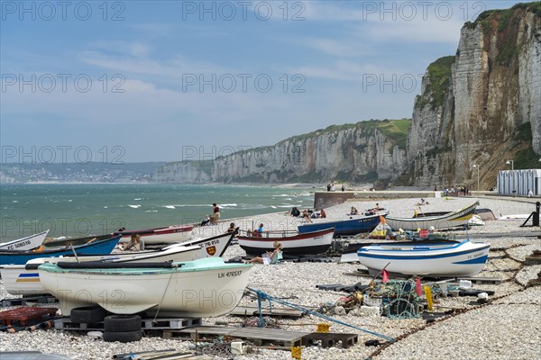 Fishing boats on the beach and the rocky cliffs of Yport