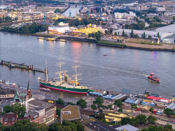 Aerial view of the port of Hamburg at blue hour with landing stages