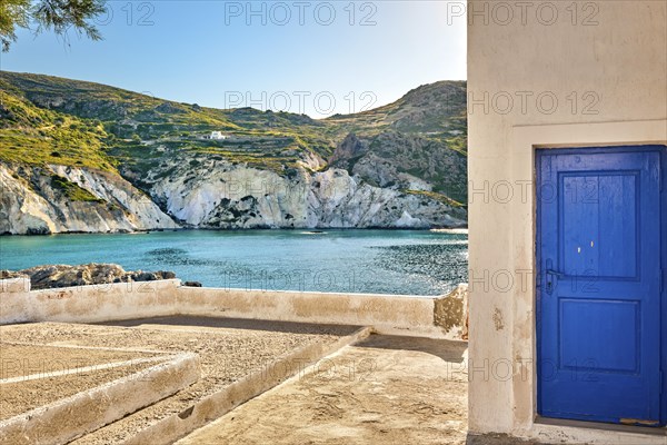 Sunny summer landscape on Greek island. Traditional whitewashed terrace