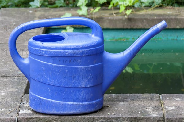 Blue watering can