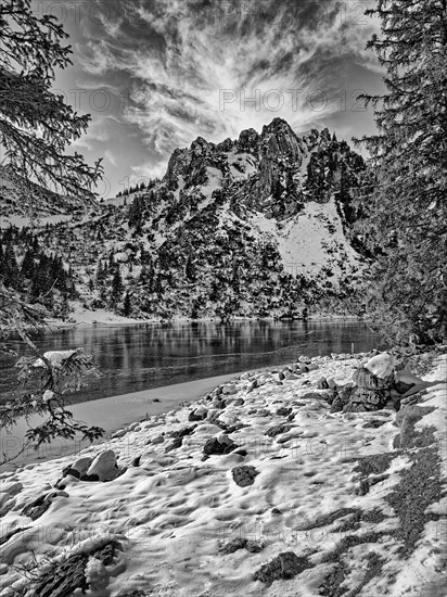 Frozen lake with mountain and snow