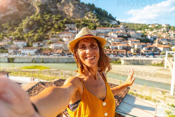 Selfie of a young woman in the historic town of Berat in Albania at sunset