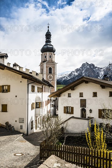 Village and snow-capped mountains