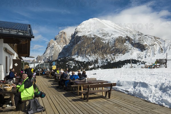 Snow-covered mountains and ski hut