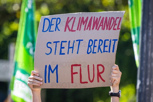 Numerous people have gathered on the Opernplatz in Frankfurt am Main in front of the Alte Oper on 15.09.2023. Climate change is ready in the hallway is written on a sign held aloft. With more than 200 demonstrations and rallies throughout Germany