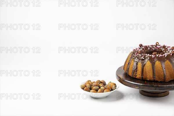 Vegan hazelnut cake on wooden serving plate