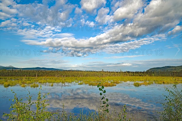 Clouds reflected in a crystal clear