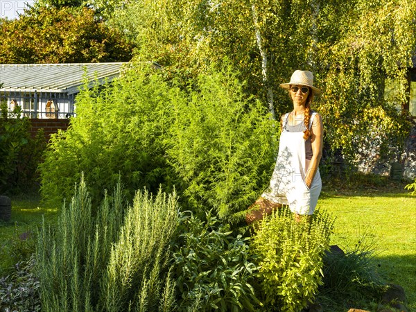 Woman in herb bed