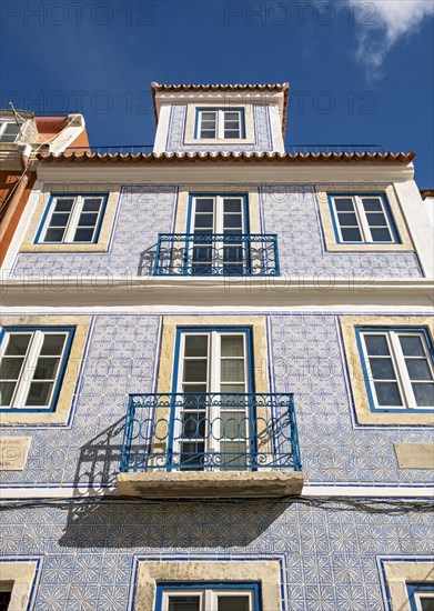 Windows and facade of traditional azulejo wall tiles