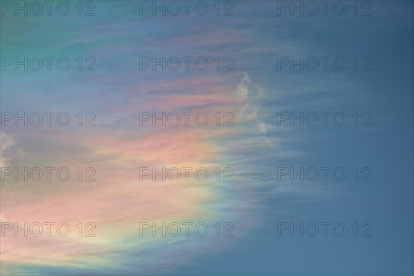 Quite rare optical phenomenon of iridescence of clouds of pearly