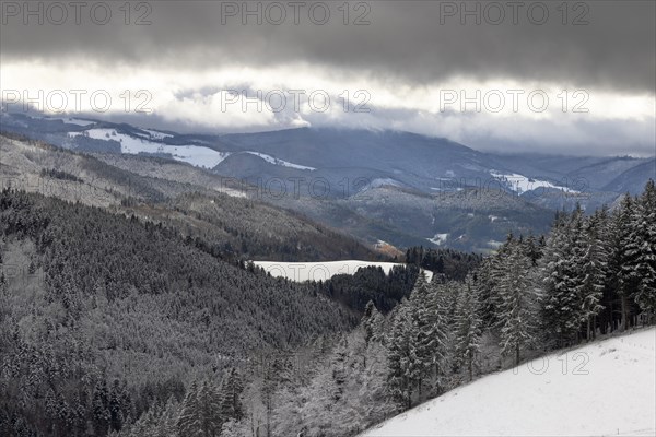 Fresh snow in November with a wonderful view of the Black Forest in a cloudy atmosphere