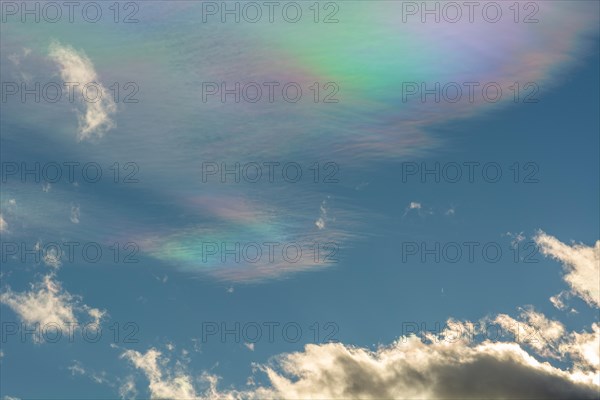 Quite rare optical phenomenon of iridescence of clouds of pearly