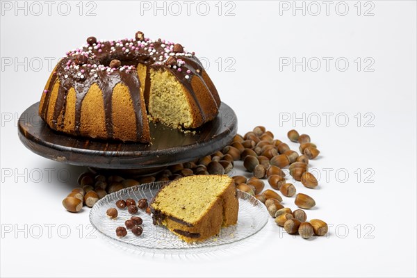 Vegan hazelnut cake on wooden serving plate