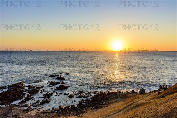 Sunset at the Barra lighthouse in the city of Salvador with a view of All Saints bay