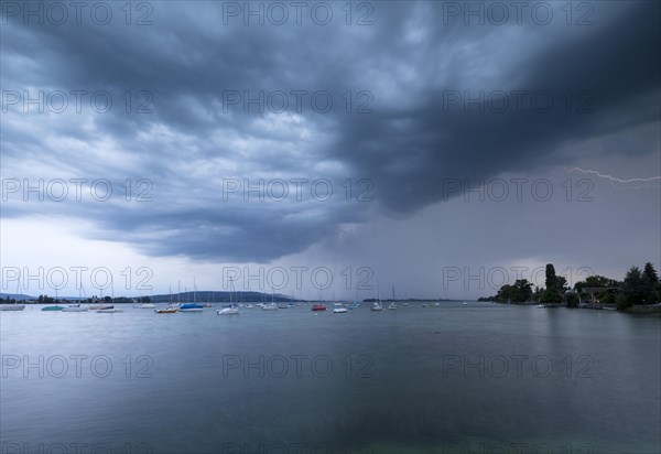 Light thunderstorm with rain shower with sailing boats