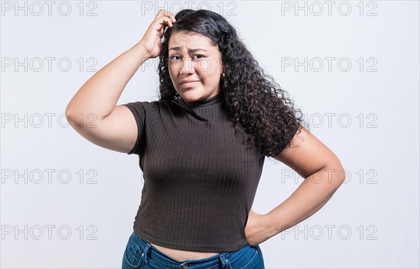 Confused girl scratching her head isolated. Worried woman scratching head with confused face isolated