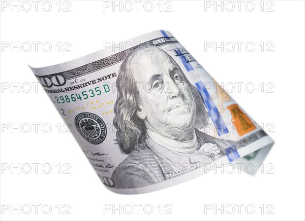 One hundred dollar bill falling or floating on empty background