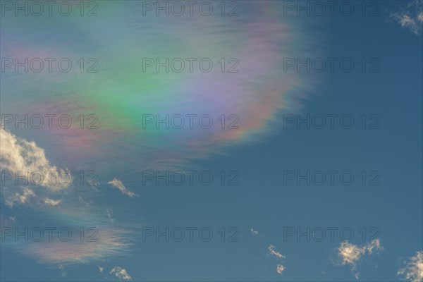 Quite rare optical phenomenon of iridescence of clouds of pearly