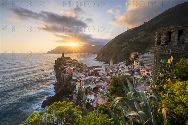 View of the colourful houses of Vernazza at sunset