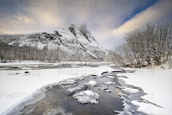 Winter stream in front of Mount Otertinden