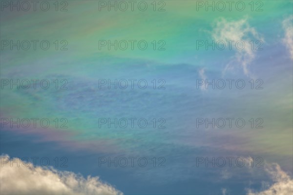 Quite rare optical phenomenon of iridescence of clouds of pearly