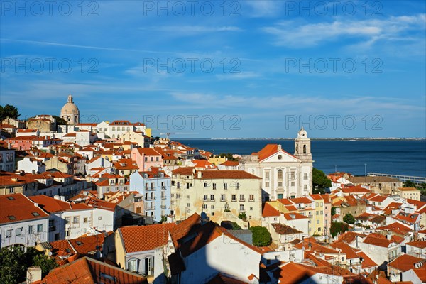 View of Lisbon famous postcard iconic view from Miradouro de Santa Luzia tourist viewpoint over Alfama old city district. Lisbon