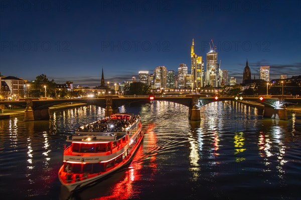 A ship sails along the Main River in the evening