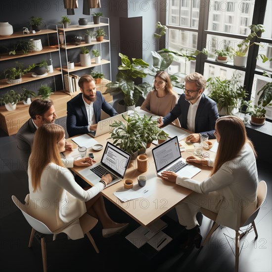 Dynamic young employees work together in a modern bright office
