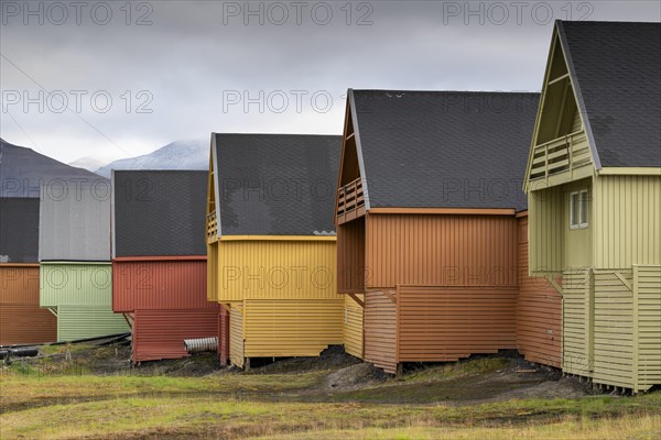 Colourful wooden houses in the settlement of Longyearbyen in autumn