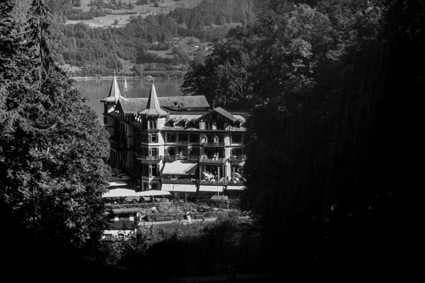 The Historical Grandhotel Giessbach on the Mountain Side in Giessbach