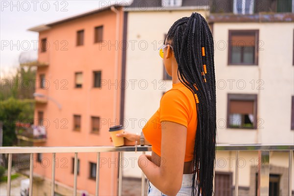 A young trap dancer with braids. Black ethnic girl with t-shirt