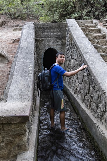 Tourist walks into the walk-in tunnel