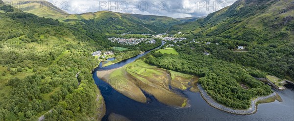 Aerial panorama of the village of Kinlochleven with the mouth of the River Leven at the eastern part of the freshwater loch Lochleven